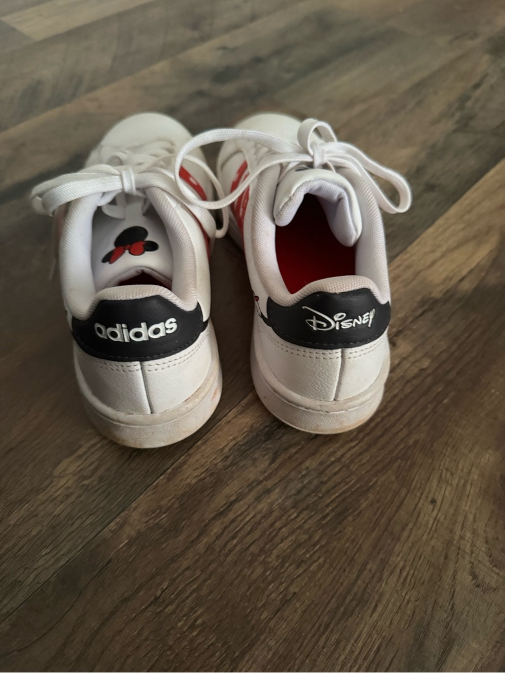 adidas White Sneakers with Black Heel Tabs and Red Accents